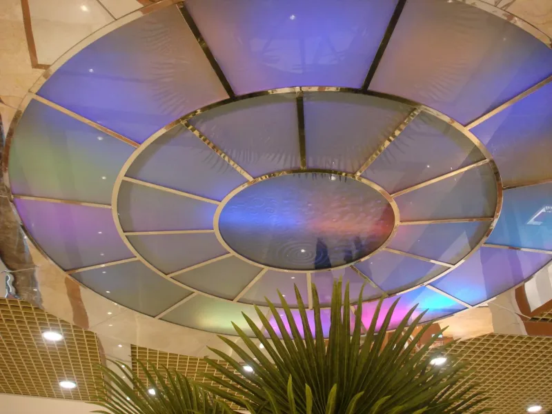 Circular multicolour backlit glass ceiling panels with polished steel dividers